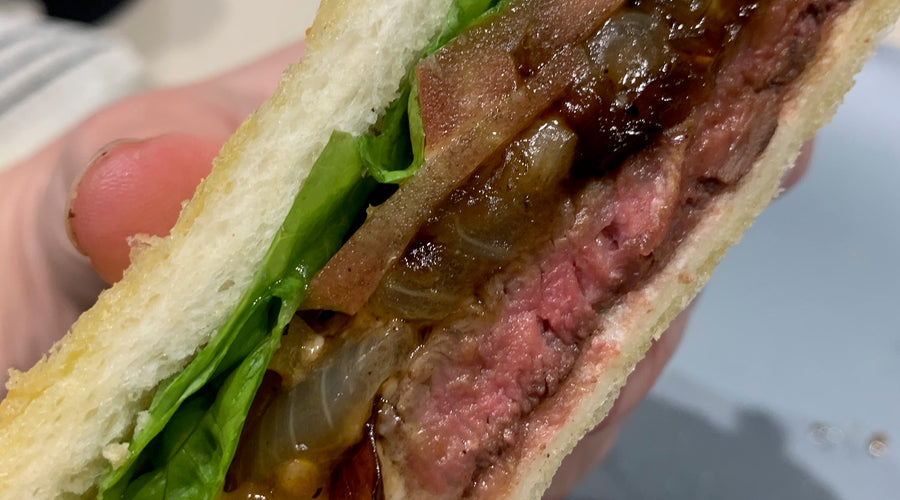 “Ellice's Steak Sanga with Jammy Onions and Cheesy Bread”